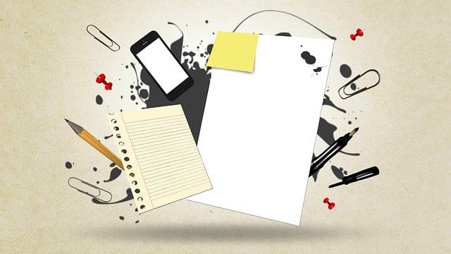 A stock image of paper, including notebooks and plain paper sheets