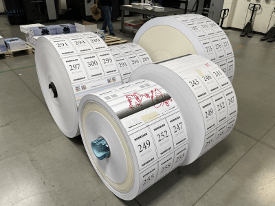 These rolls of printed book files will soon be moved to another machine to be cut into individual pages.